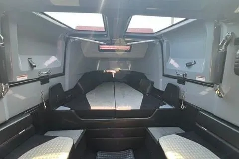 Slide: The Image of Interior of 2021 BRABUS 900 Shadow, featuring sleek, modern design and spacious seating. - 25
