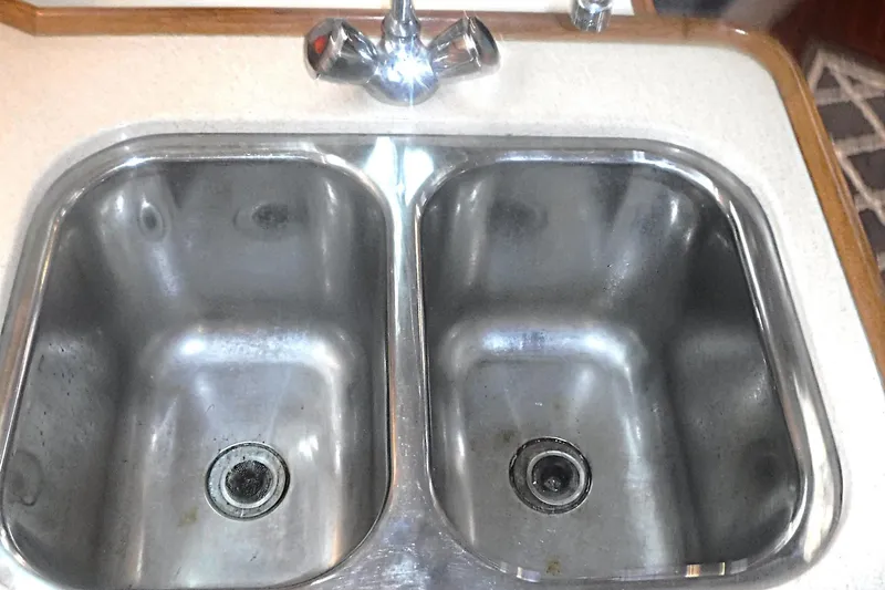 Slide: The Image of Stainless steel double sink with faucet in a 1998 Catalina 320 boat kitchen. - 35