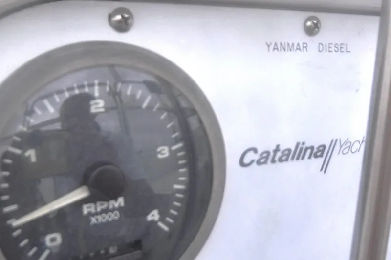 Slide: The Image of RPM gauge and Catalina Yacht branding on a 1998 Catalina 320 with Yanmar diesel engine. - 23