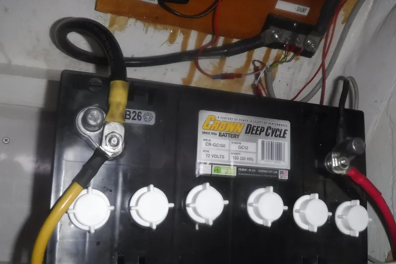 Slide: The Image of Deep cycle battery in a 1998 Catalina 320, featuring Crown CR-GC150 model. - 78