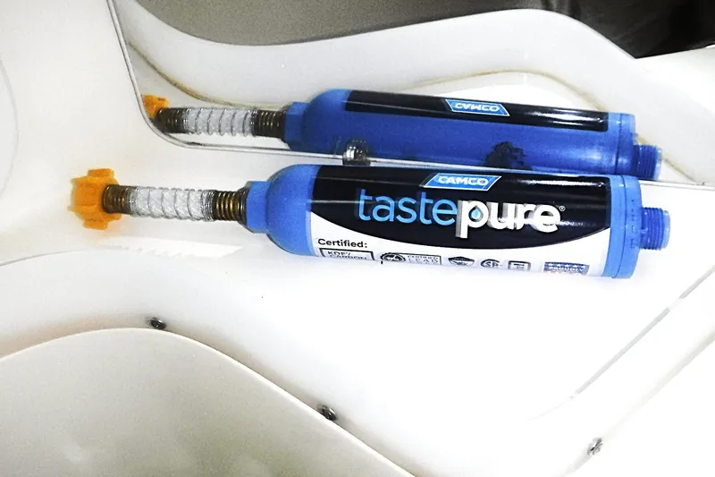 Slide: The Image of Camco TastePURE water filter installed on a Catalina 320 yacht, model year 1998. - 63