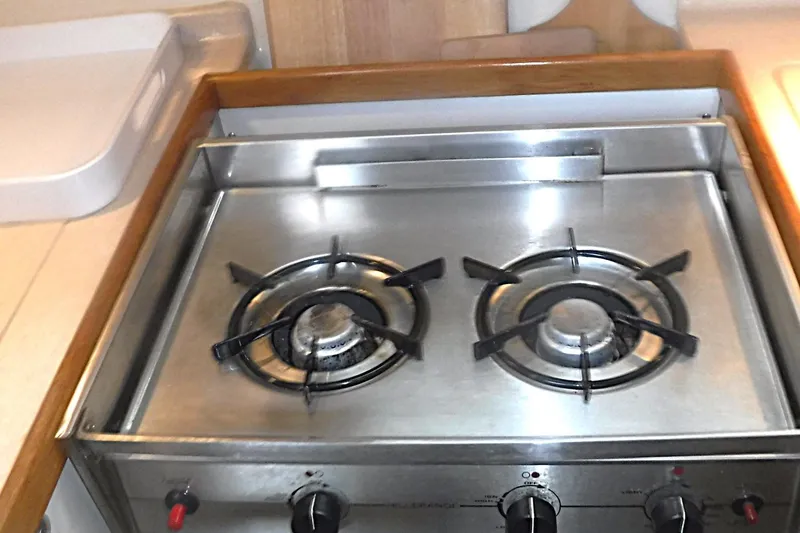 Slide: The Image of Stainless steel stove with two burners in a 1998 Catalina 320 yacht kitchen. - 37