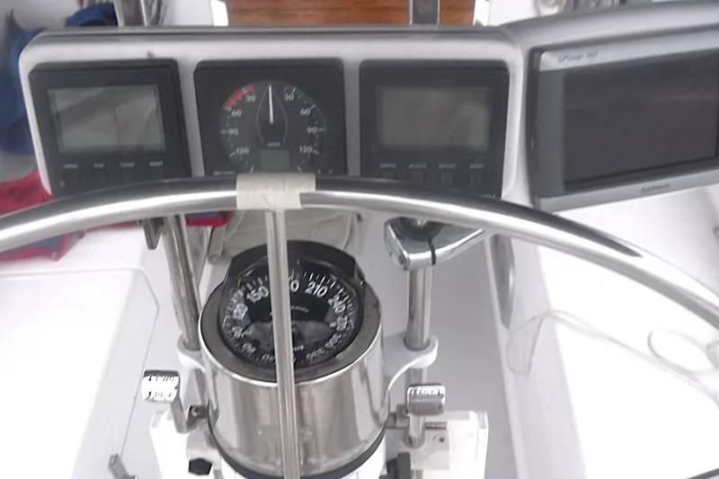 Slide: The Image of Cockpit of 1998 Catalina 320 sailboat with navigation instruments and compass. - 18