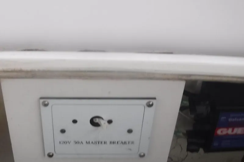 Slide: The Image of Electrical panel with 120V 50A master breaker on a 1998 Catalina 320 boat. - 14