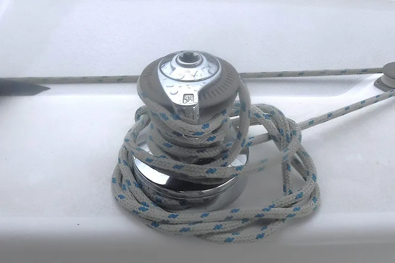 Slide: The Image of Winch with rope on 1998 Catalina 320 sailboat deck. - 26