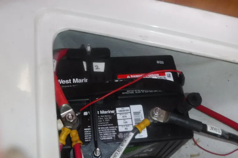 Slide: The Image of Battery compartment of a 1998 Catalina 320 sailboat with West Marine battery. - 77