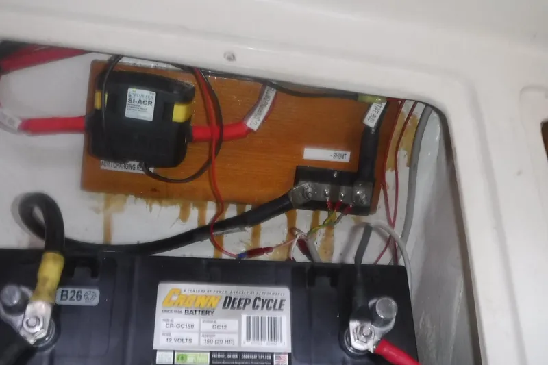 Slide: The Image of Battery compartment of a 1998 Catalina 320 sailboat with deep cycle battery and wiring. - 81