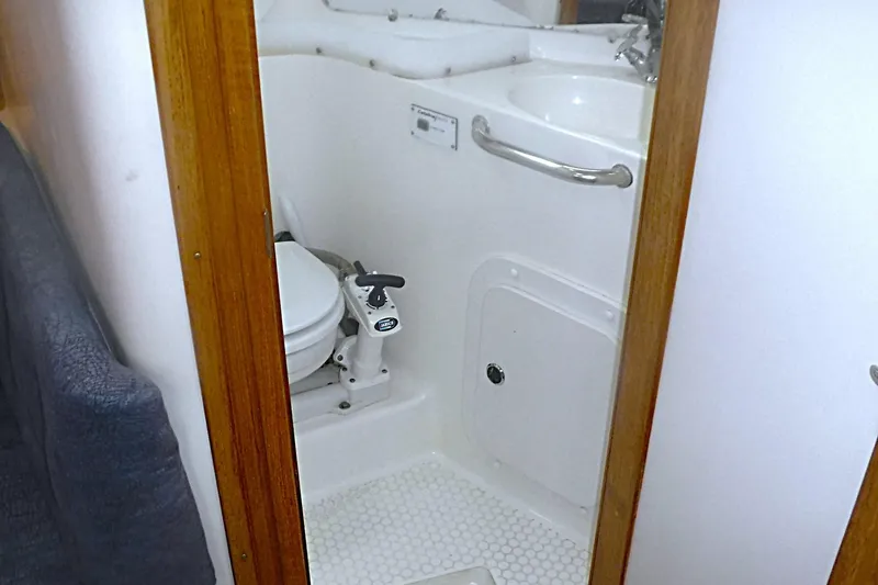 Slide: The Image of 1998 Catalina 320 yacht bathroom with toilet and sink. - 64