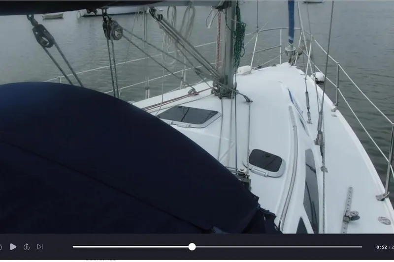 Slide: The Image of Sailboat deck view of a 1998 Catalina 320 on calm waters. - 6