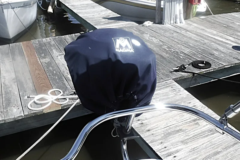 Slide: The Image of Covered grill on a Catalina 320 sailboat docked at a marina. - 16