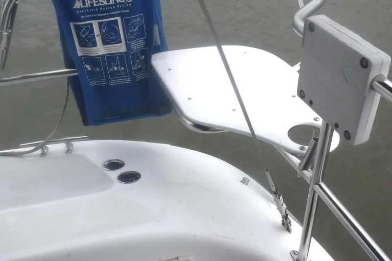 Slide: The Image of Sailboat deck with lifebuoy holder, Catalina 320, 1998 model. - 10