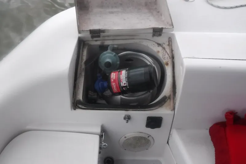 Slide: The Image of Open compartment on 1998 Catalina 320 sailboat with propane tank and stove. - 12