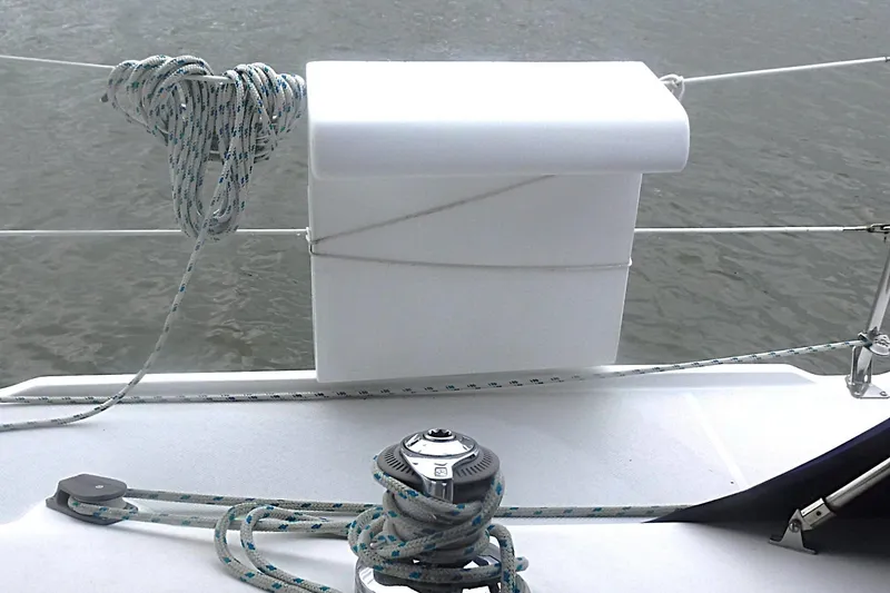 Slide: The Image of Sailboat deck of 1998 Catalina 320 with ropes and winch by the water. - 27