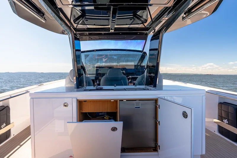 Slide: The Image of 2024 Pardo Yachts 43 interior with open cabinets, sleek design, and ocean view. - 22