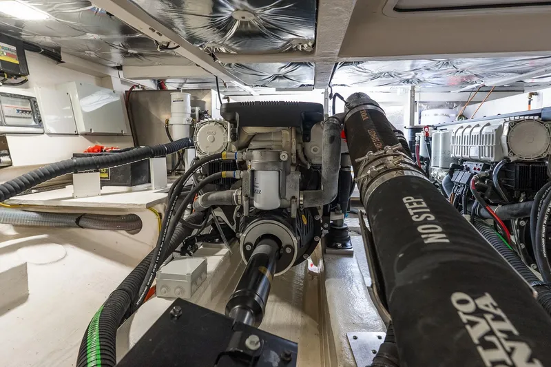 Slide: The Image of Engine room of 2024 Pardo Yachts 43, showcasing mechanical components and wiring. - 49