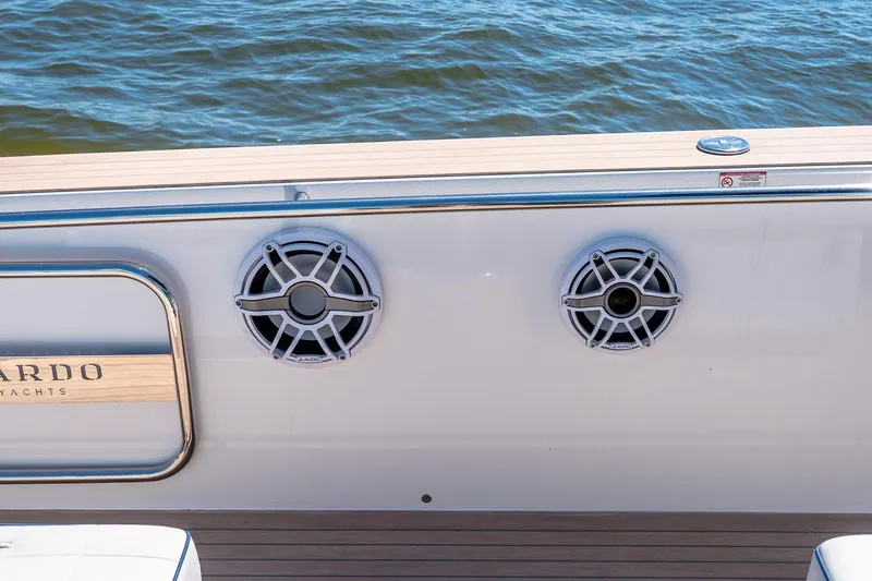 Slide: The Image of 2024 Pardo Yachts 43, featuring sleek speakers and elegant design against a serene water backdrop. - 13