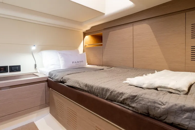 Slide: The Image of Luxurious cabin interior of 2024 Pardo Yachts 43, featuring elegant bedding and modern design. - 45