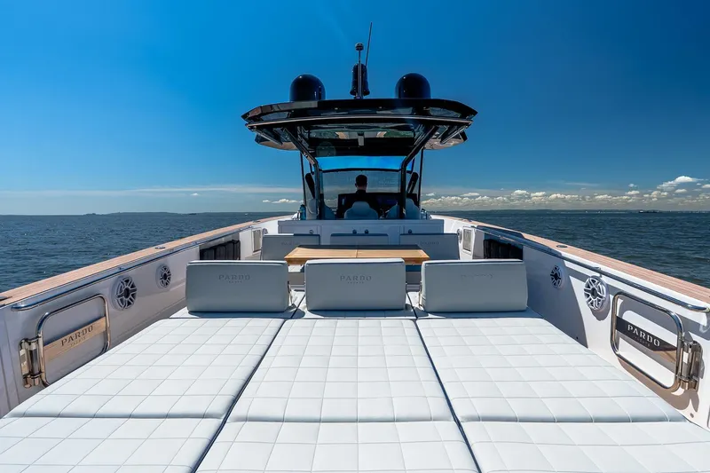 Slide: The Image of 2024 Pardo Yachts 43 luxury yacht with spacious deck and seating, cruising on open water. - 16