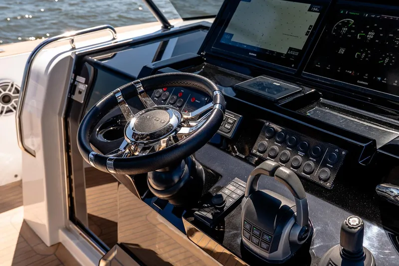 Slide: The Image of Cockpit of 2024 Pardo Yachts 43, featuring modern steering and navigation controls. - 32