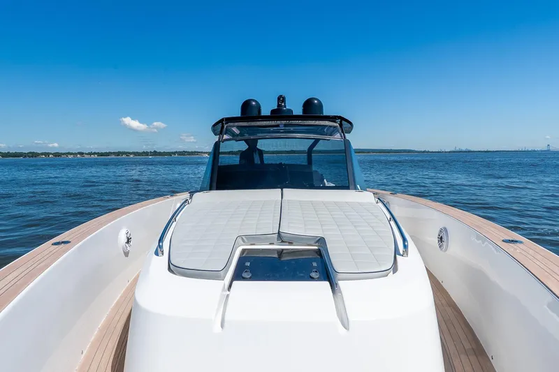Slide: The Image of 2024 Pardo Yachts 43 cruising on open water under clear blue skies. - 52