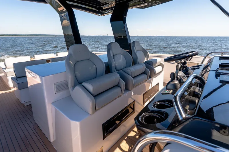 Slide: The Image of 2024 Pardo Yachts 43 cockpit with luxurious seating and modern helm, cruising on open water. - 28