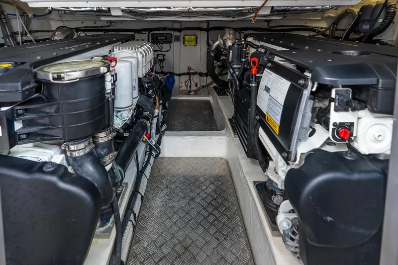 Slide: The Image of Engine room of 2024 Pardo Yachts 43, showcasing dual engines and mechanical components. - 47