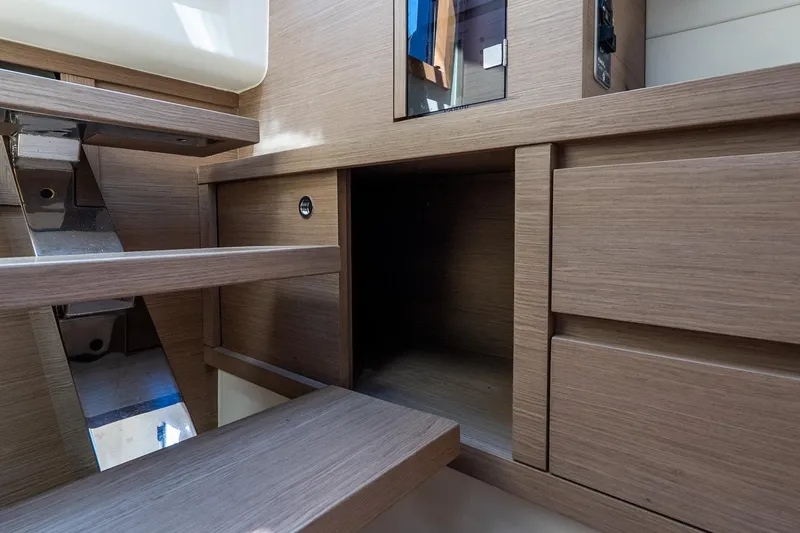 Slide: The Image of Interior of 2024 Pardo Yachts 43, featuring wooden cabinetry and stairs. - 36