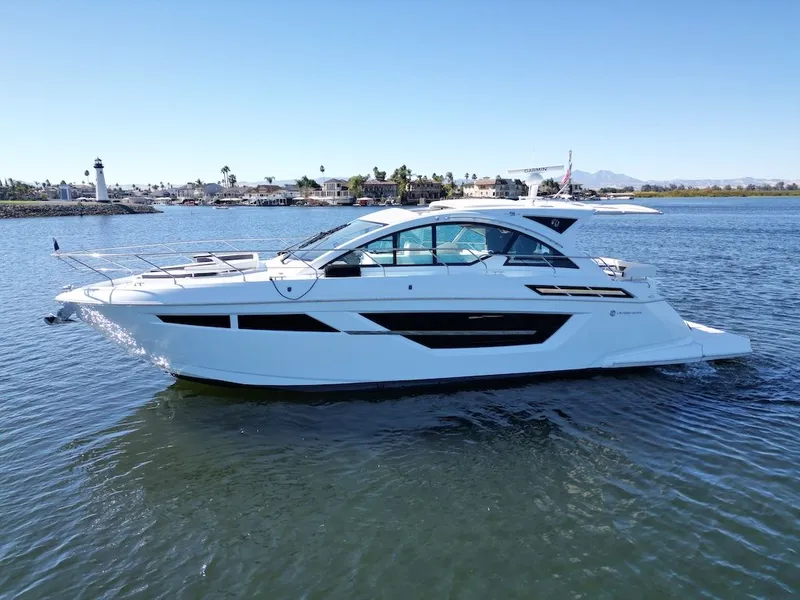 Slide: The Image of 2019 Cruisers Yachts 50 Cantius on calm water with sleek, modern lines. - 4