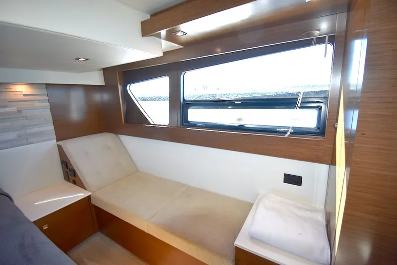 Slide: The Image of Interior of a 2019 Cruisers Yachts 50 Cantius with modern design and large windows. - 33
