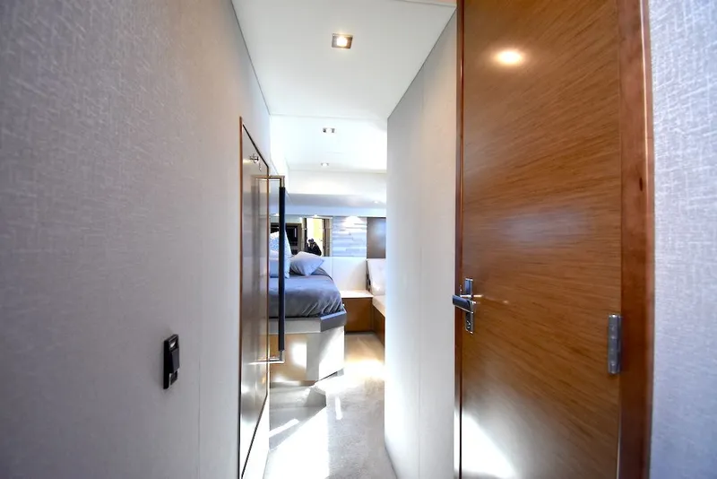 Slide: The Image of Hallway in a 2019 Cruisers Yachts 50 Cantius leading to a bedroom. - 29