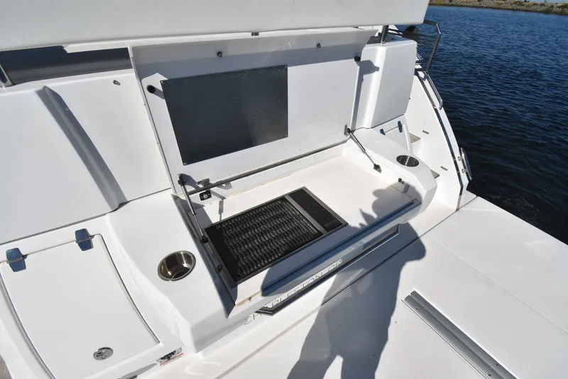 Slide: The Image of The 2019 Cruisers Yachts 50 Cantius features a spacious aft deck with a grill and storage. - 46