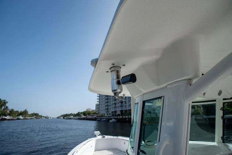 Slide: The Image of 2006 Everglades 290 Center Console boat on a sunny waterway. - 26