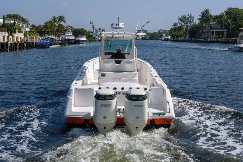 Slide: The Image of 2006 Everglades 290 Center Console boat cruising on a scenic waterway. - 4