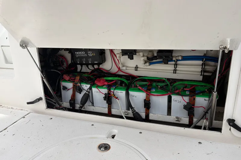 Slide: The Image of Battery compartment of a 2006 Everglades 290 Center Console boat with NOCO Genius charger. - 30