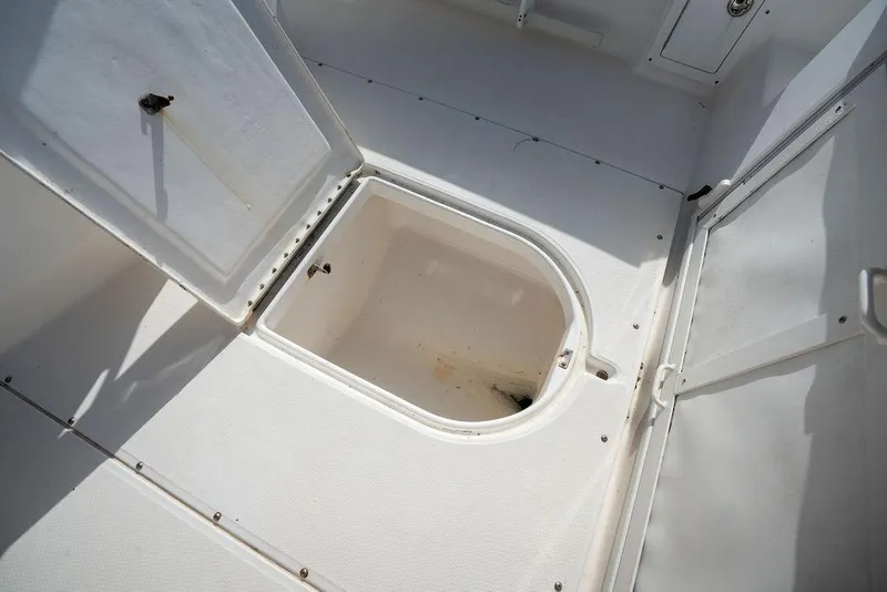 Slide: The Image of Open storage compartment on 2006 Everglades 290 Center Console boat deck. - 20