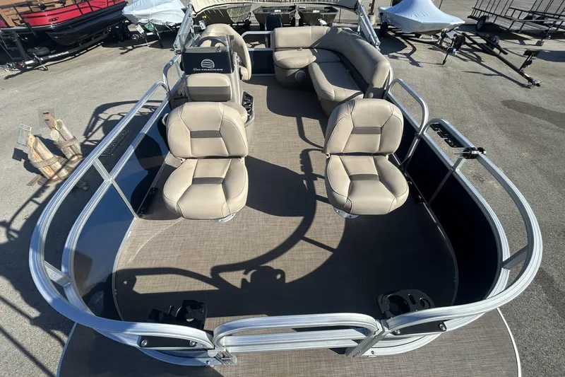 Slide: The Image of 2023 Sun Tracker Bass Buggy 16 XL Select pontoon boat with beige seating. - 6