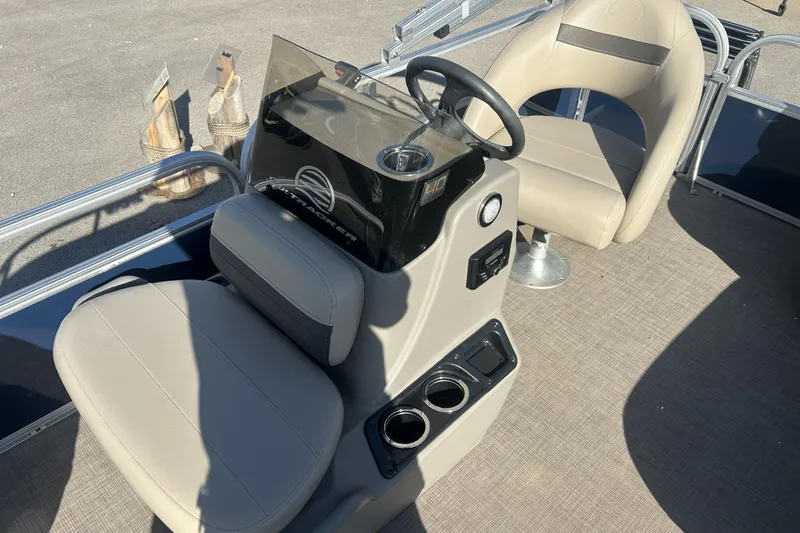 Slide: The Image of 2023 Sun Tracker Bass Buggy 16 XL Select boat interior with steering console and seating. - 8