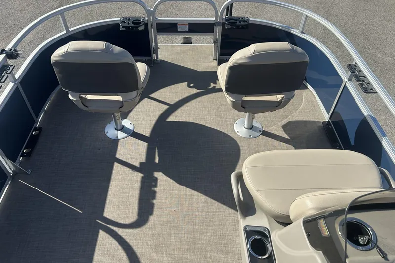 Slide: The Image of 2023 Sun Tracker Bass Buggy 16 XL Select pontoon boat interior with seating and steering console. - 12