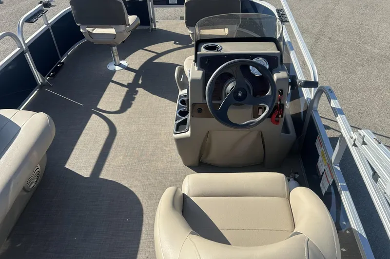 Slide: The Image of 2023 Sun Tracker Bass Buggy 16 XL Select interior with steering console and seating. - 11