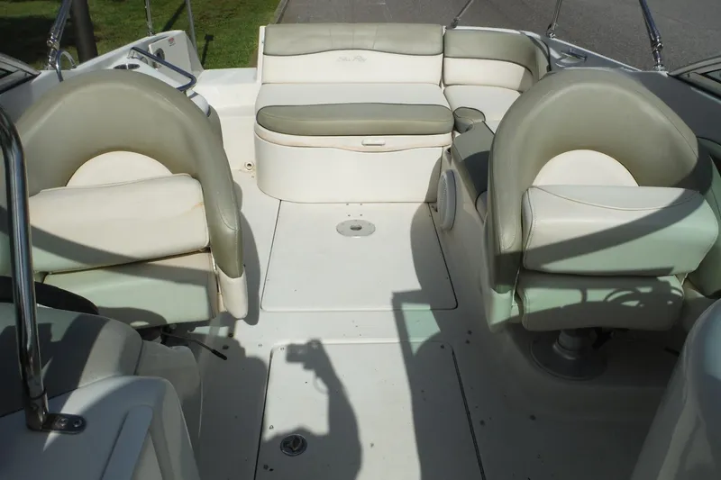 Slide: The Image of 2005 Sea Ray 240 Sundeck interior with spacious seating and elegant design. - 12