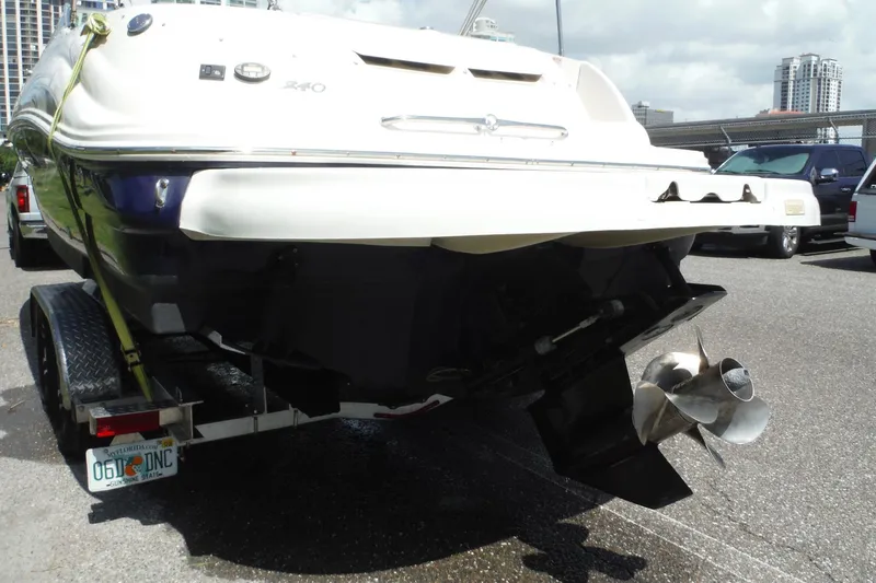 Slide: The Image of Rear view of a 2005 Sea Ray 240 Sundeck boat on a trailer. - 41