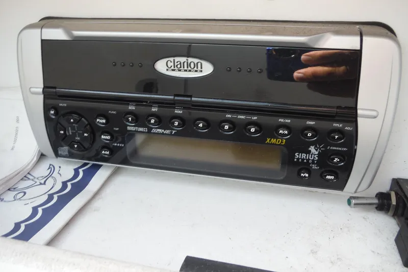 Slide: The Image of Clarion Marine stereo system in a 2005 Sea Ray 240 Sundeck boat. - 16