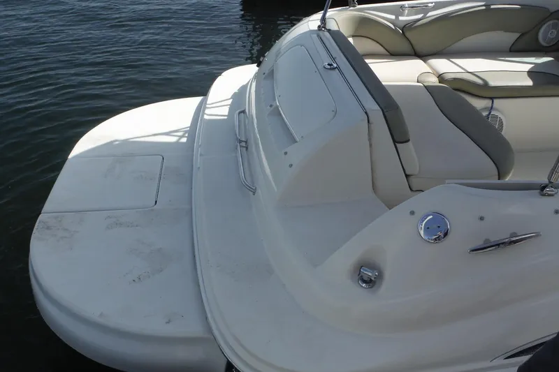 Slide: The Image of 2005 Sea Ray 240 Sundeck boat with spacious seating and swim platform. - 29