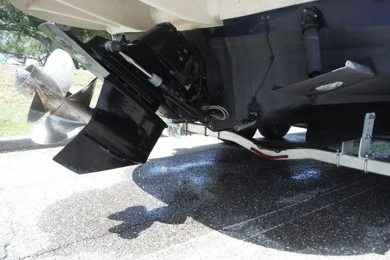 Slide: The Image of Rear view of a 2005 Sea Ray 240 Sundeck boat showing propeller and outdrive. - 40