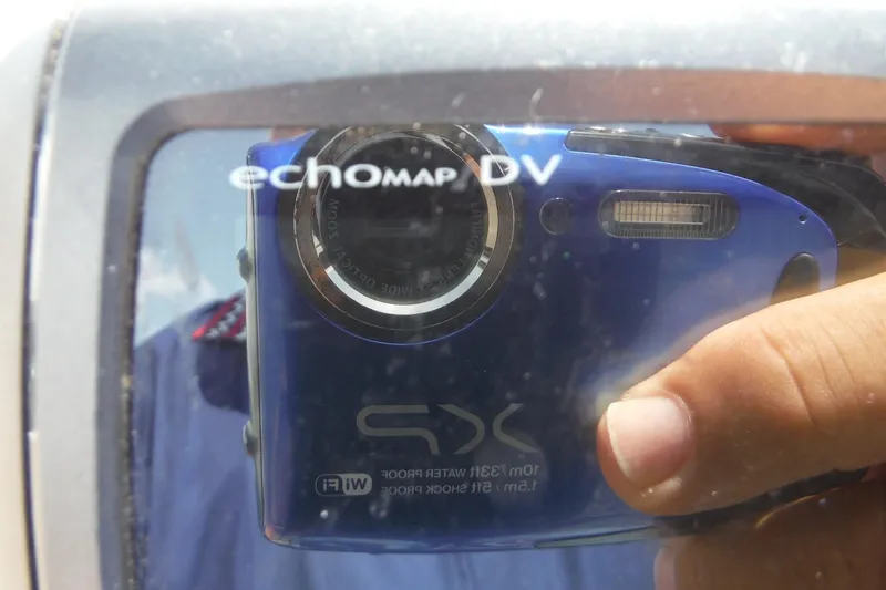 Slide: The Image of Reflection of a camera on a Sea Ray 240 Sundeck's echomap DV screen. - 36