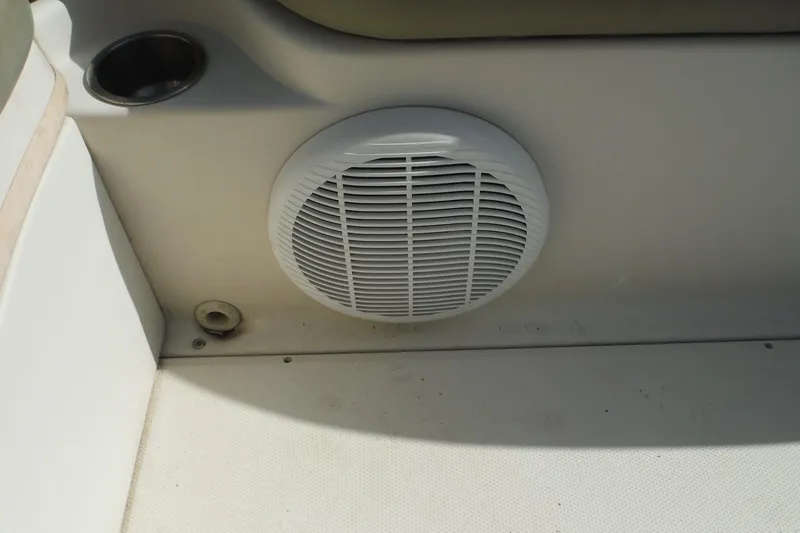 Slide: The Image of Speaker and cup holder on 2005 Sea Ray 240 Sundeck boat interior. - 14