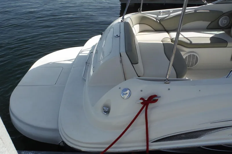 Slide: The Image of 2005 Sea Ray 240 Sundeck boat with spacious seating and swim platform. - 33