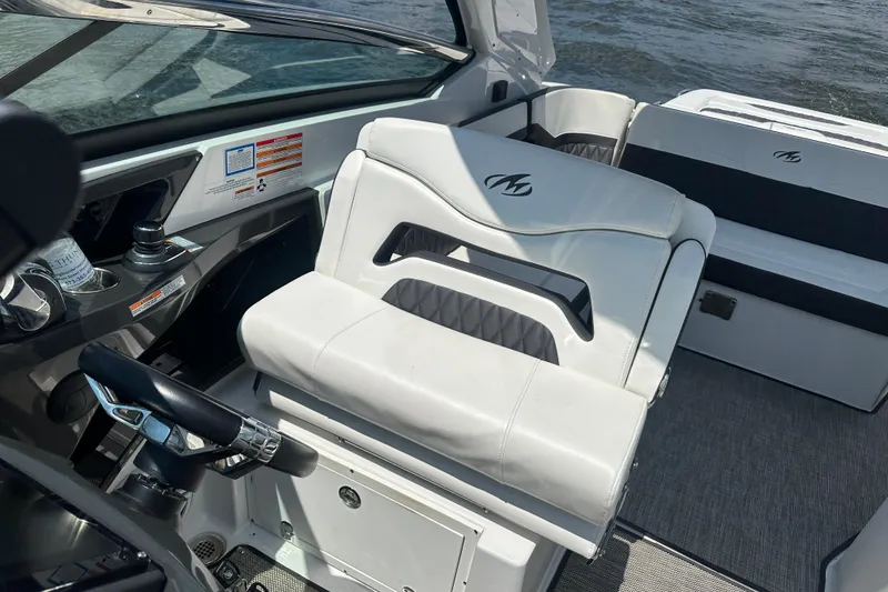 Slide: The Image of 2019 Monterey 328SS Super Sport boat interior with white seating and steering wheel. - 8