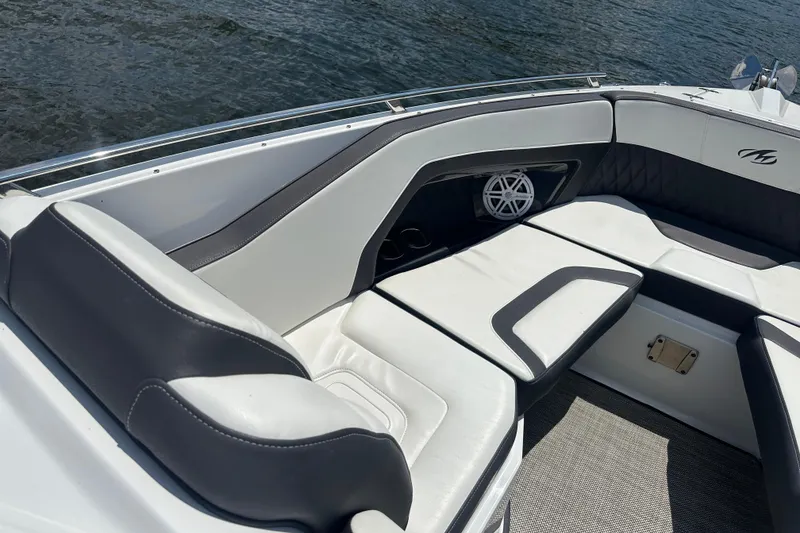 Slide: The Image of 2019 Monterey 328SS Super Sport boat interior with sleek seating and speaker detail. - 5