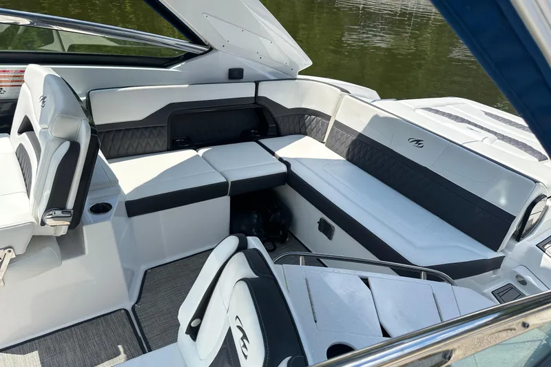 Slide: The Image of 2019 Monterey 328SS Super Sport boat interior with luxurious seating and sleek design. - 21